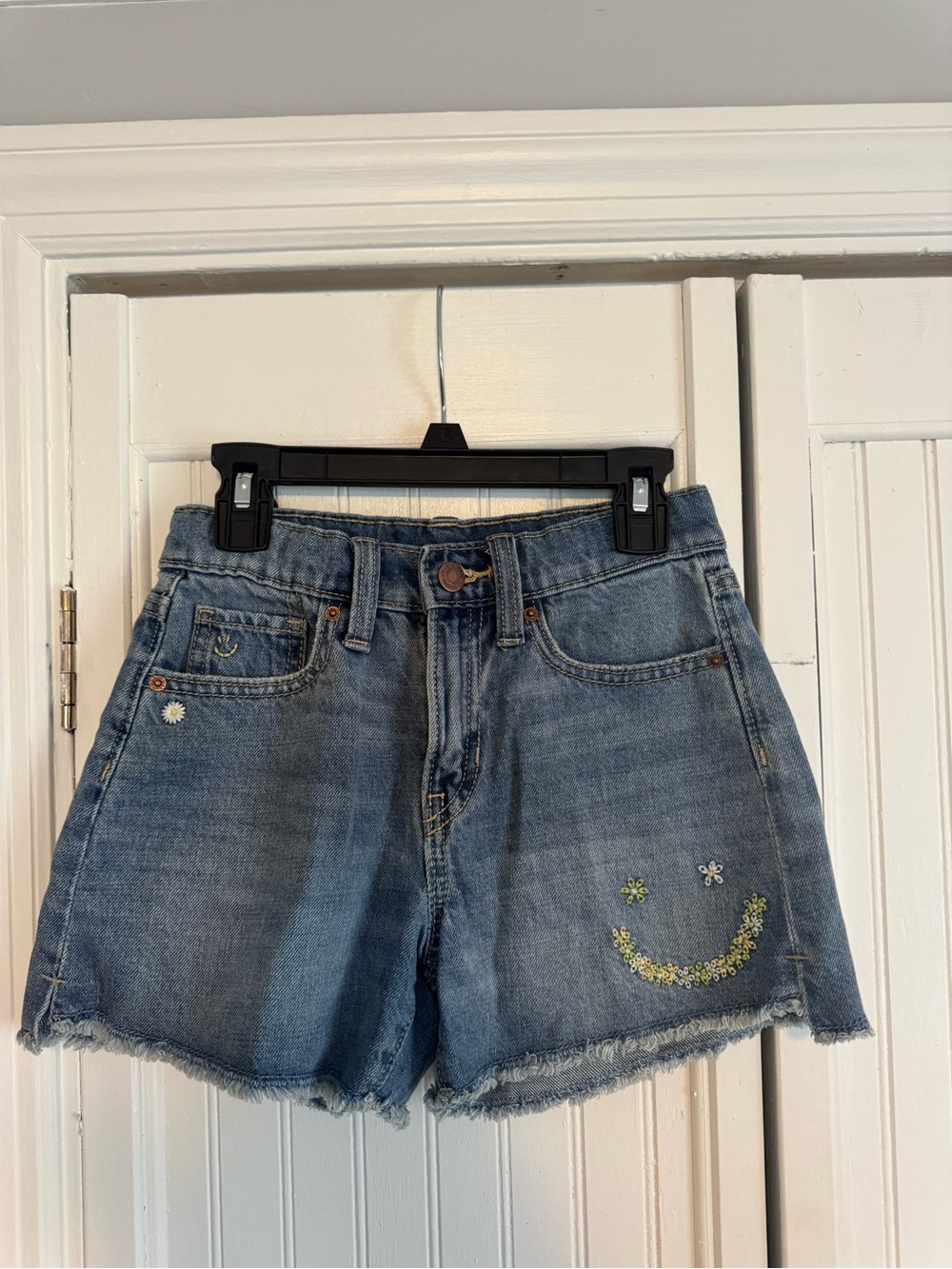 Old Navy Blue Denim Cutoff Shorts with Embroidered Smile and Daisies